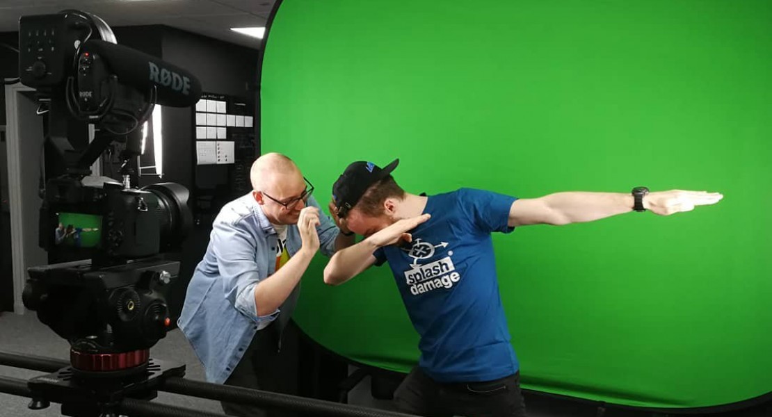 A picture of Luc Shelton (myself) posing or "dabbing" in front of a green screen for the media and marketing team.