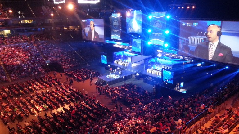 LANXESS Arena from the VIP seating area. The caster Json "moses" O'Toole presenting in front of the stadium audience before the next game.